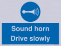 sound-horn-drive-slowly-warehousing-and-delivery-sign~